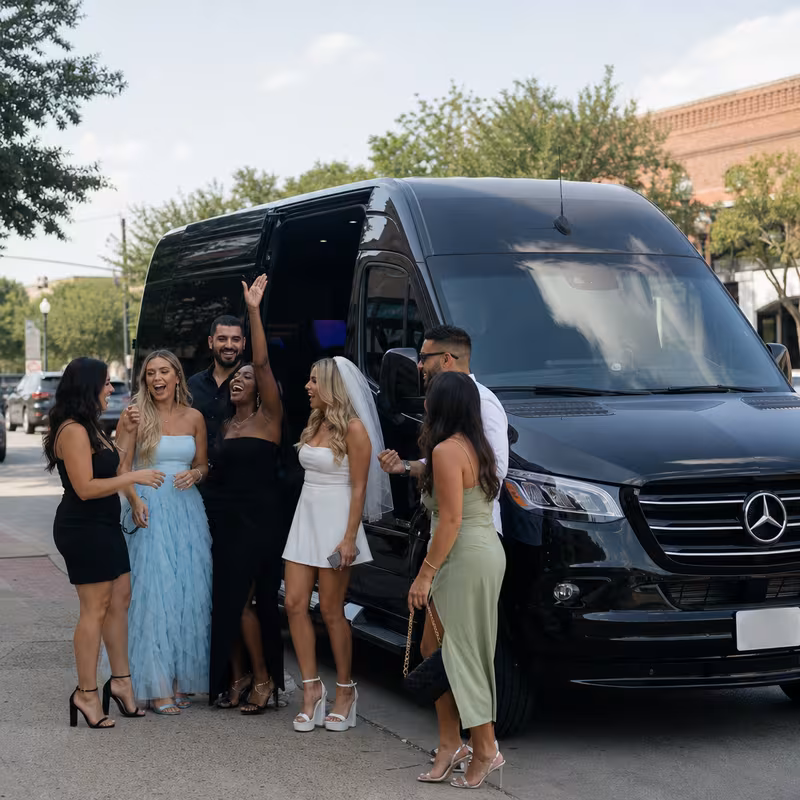 Group boarding a white charter bus for Bachelor & Bachelorette Transportation transportation in Carrollton