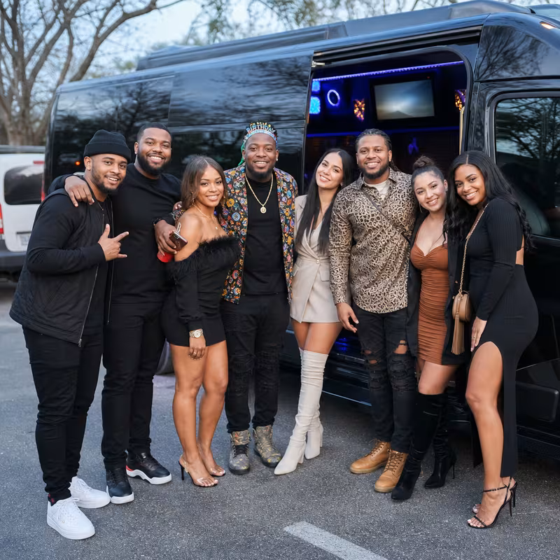 Group boarding a white charter bus for Birthday Transportation transportation in Carrollton