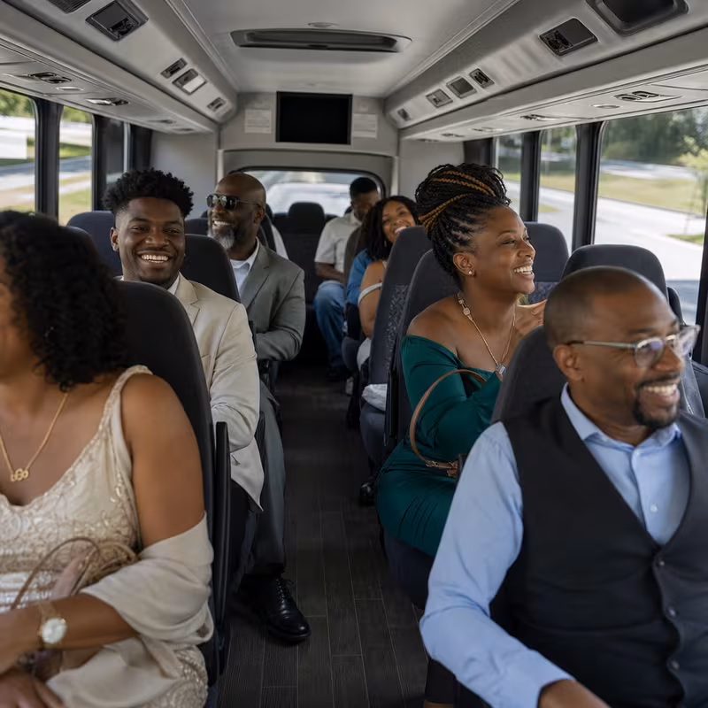 Group boarding a white charter bus for Private Event Transportation transportation in Carrollton
