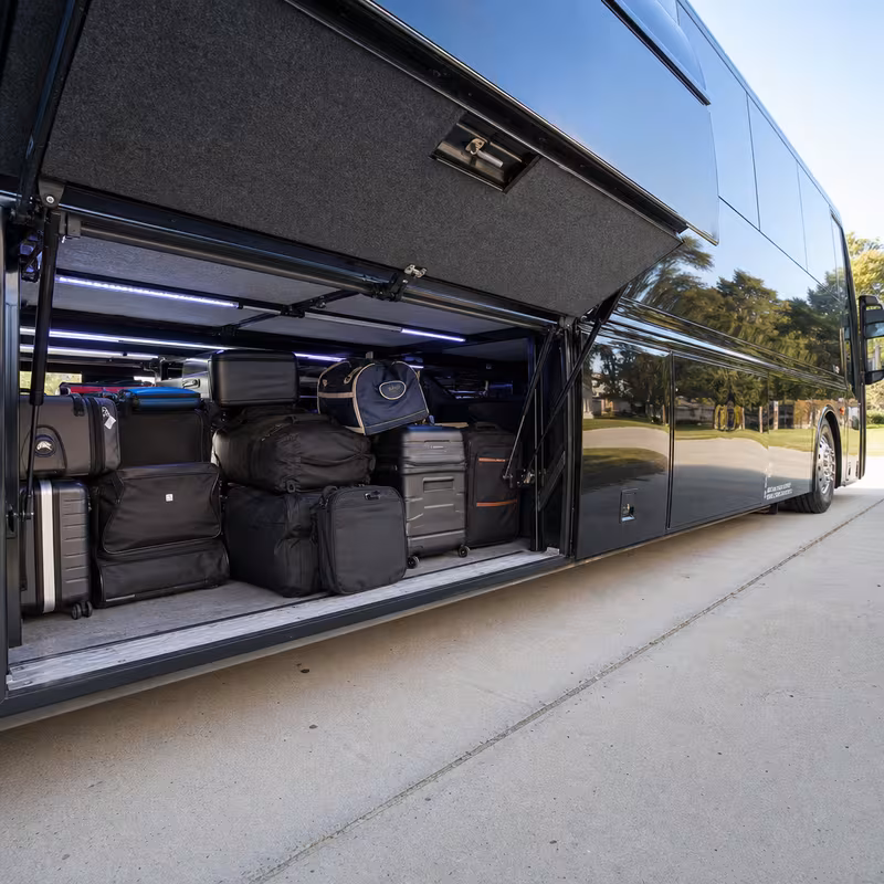 Party bus interior with wraparound leather seating and LED lighting in Carrollton