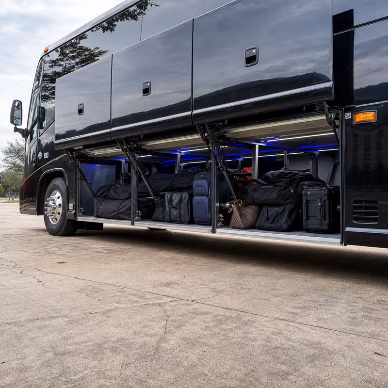 Party bus interior with wraparound leather seating and LED lighting in Carrollton