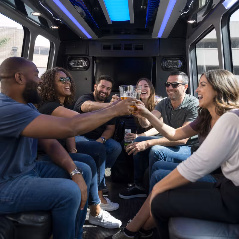 Group boarding a white charter bus for Winery & Brewery Tour Transportation transportation in Carrollton