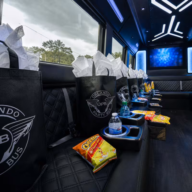 Party bus interior with wraparound leather seating and LED lighting in Carrollton